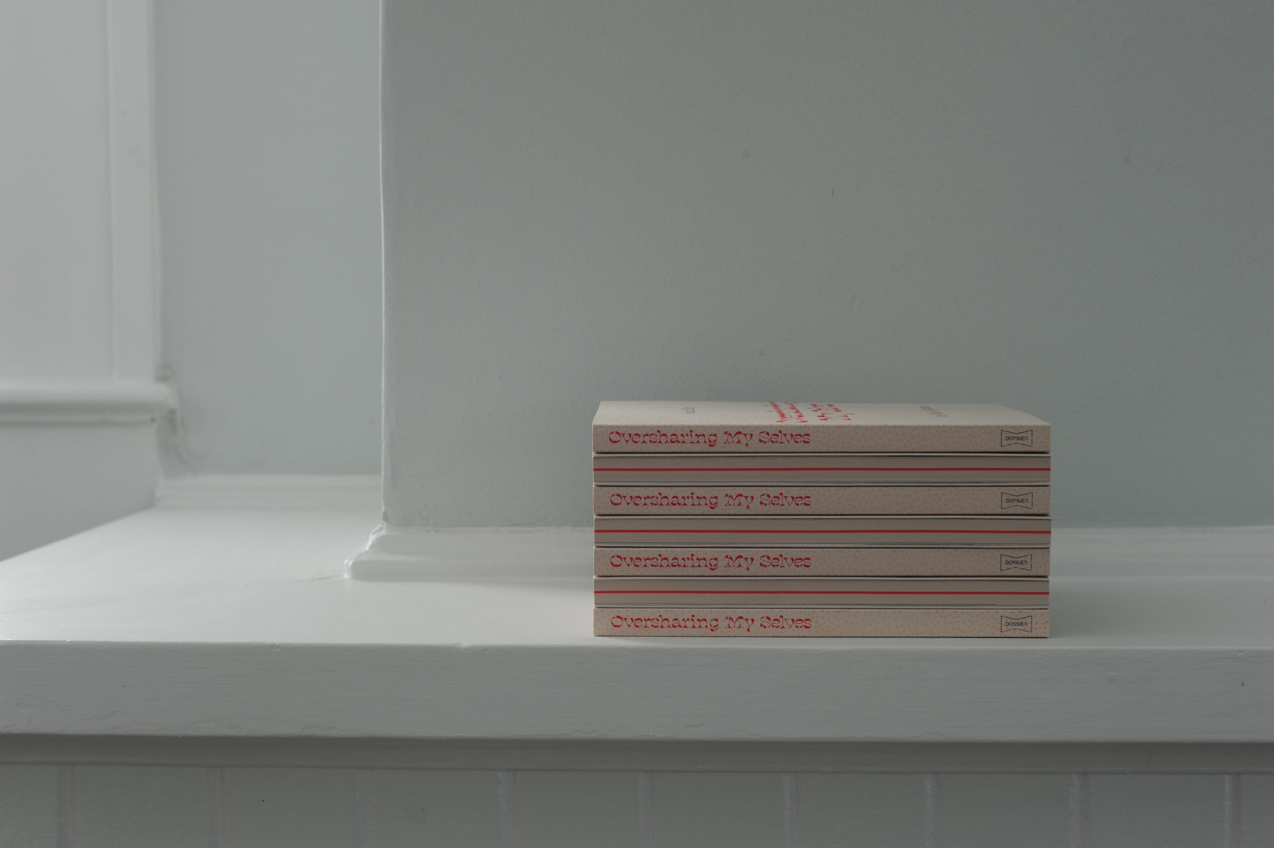 Oversharing My Selves poetry book stack on shelf